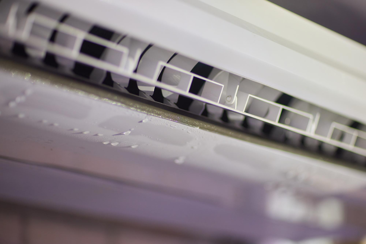 Mini split air conditioner showing water leakage and condensation, highlighting potential drainage issues in HVAC systems.